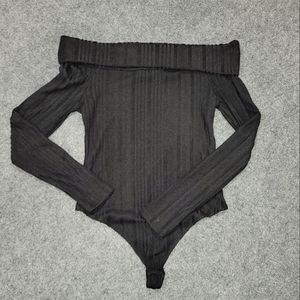 Off shoulder black ribbed bodysuit.